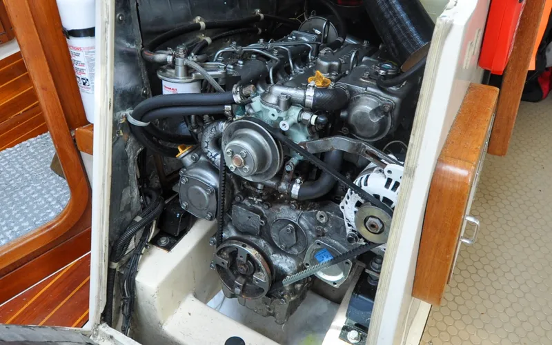 Slide: The Image of 1993 Catalina 42 | Kanga Engine compartment of a 1993 Catalina 42 sailboat, showcasing mechanical components. - 6318950
