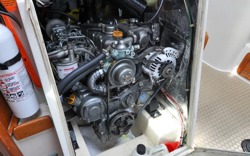 Slide: The Image of 1993 Catalina 42 | Kanga Engine compartment of a 1993 Catalina 42 sailboat, featuring a Yanmar diesel engine. - 6318949