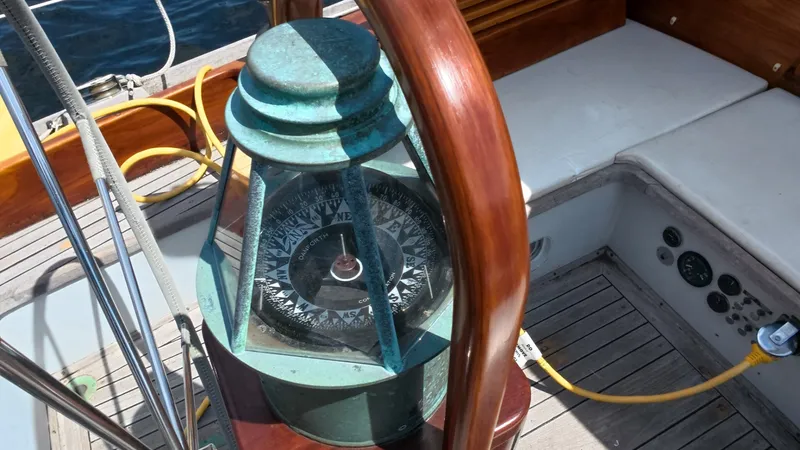 Slide: The Image of 1987 Wittholtz/Luzier 49 | Destiny Vintage compass on 1987 Custom Wittholtz/Luzier Sloop/Cutter yacht, featuring wooden and metal details. - 6319050