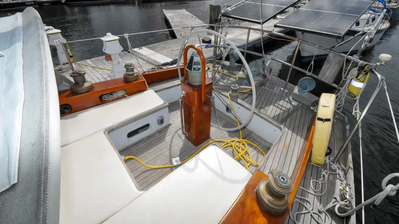 Slide: The Image of 1987 Wittholtz/Luzier 49 | Destiny Cockpit of 1987 Custom Wittholtz/Luzier Sloop/Cutter with wooden finish and steering wheel. - 6318992