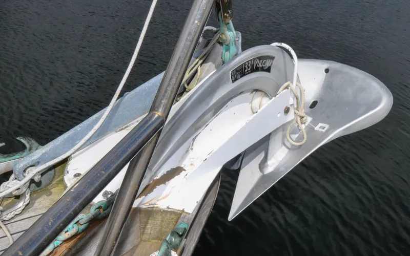 Slide: The Image of 1987 Wittholtz/Luzier 49 | Destiny Anchor on 1987 Custom Wittholtz/Luzier Sloop/Cutter, secured with ropes, over water. - 6319003
