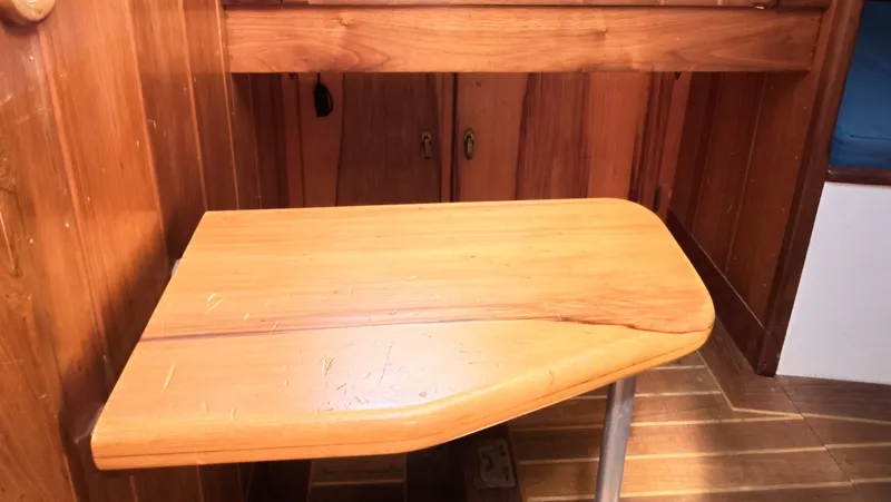 Slide: The Image of 1987 Wittholtz/Luzier 49 | Destiny Wooden interior of 1987 Custom Wittholtz/Luzier Sloop/Cutter, featuring a foldable table. - 6323956