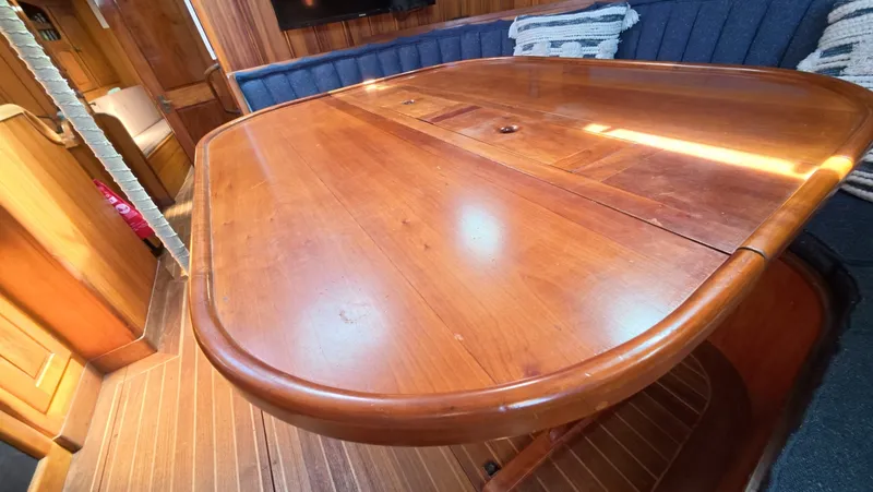 Slide: The Image of 1987 Wittholtz/Luzier 49 | Destiny Wooden dining table in the cabin of a 1987 Custom Wittholtz/Luzier Sloop/Cutter yacht. - 6323958