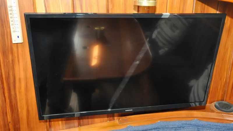 Slide: The Image of 1987 Wittholtz/Luzier 49 | Destiny Flat-screen TV mounted on wooden panel inside 1987 Custom Wittholtz/Luzier Sloop/Cutter. - 6319014