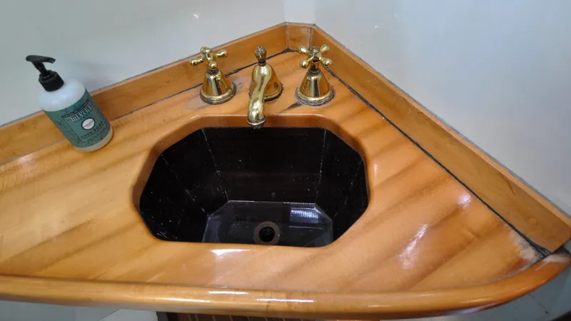 Slide: The Image of 1987 Wittholtz/Luzier 49 | Destiny Elegant wooden sink with brass fixtures on a 1987 Custom Wittholtz/Luzier Sloop/Cutter. - 6319018