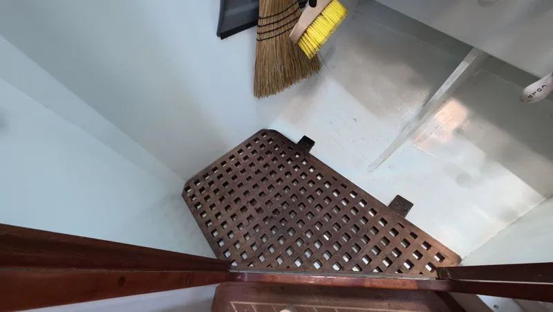 Slide: The Image of 1987 Wittholtz/Luzier 49 | Destiny Interior of 1987 Custom Wittholtz/Luzier Sloop/Cutter with wooden grate and broom. - 6323960