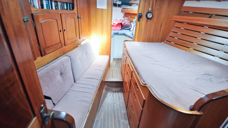 Slide: The Image of 1987 Wittholtz/Luzier 49 | Destiny Cozy 1987 Custom Wittholtz/Luzier Sloop/Cutter cabin with wooden interior and cushioned seating. - 6319021