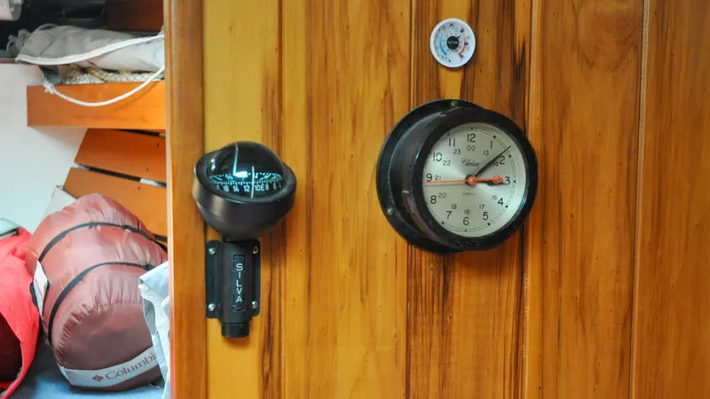 Slide: The Image of 1987 Wittholtz/Luzier 49 | Destiny Wooden interior of 1987 Wittholtz/Luzier Sloop/Cutter with compass and clock. - 6319023