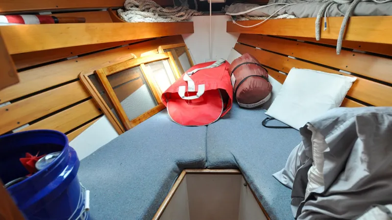 Slide: The Image of 1987 Wittholtz/Luzier 49 | Destiny Cozy cabin interior of 1987 Custom Wittholtz/Luzier Sloop/Cutter with storage and nautical gear. - 6319026
