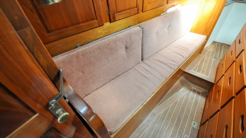 Slide: The Image of 1987 Wittholtz/Luzier 49 | Destiny Interior of 1987 Custom Wittholtz/Luzier Sloop/Cutter with wooden cabinetry and cushioned seating. - 6319031