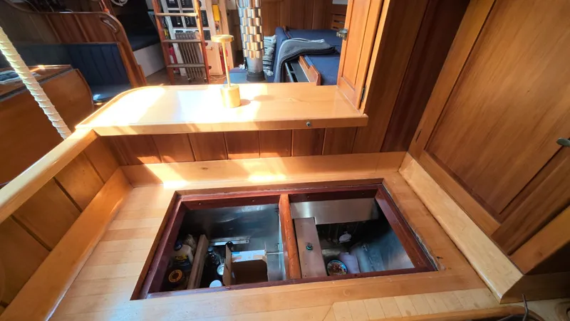 Slide: The Image of 1987 Wittholtz/Luzier 49 | Destiny Interior of 1987 Custom Wittholtz/Luzier Sloop/Cutter with open storage compartment. - 6323961