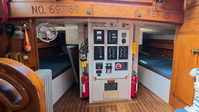 Slide: The Image of 1987 Wittholtz/Luzier 49 | Destiny Interior of 1987 Custom Wittholtz/Luzier Sloop/Cutter with control panel and sleeping quarters. - 6323963