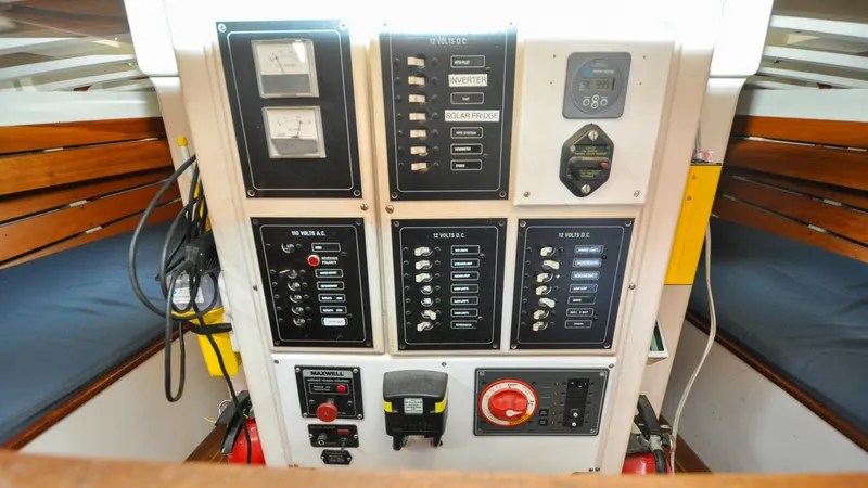 Slide: The Image of 1987 Wittholtz/Luzier 49 | Destiny Control panel of a 1987 Custom Wittholtz/Luzier Sloop/Cutter with various switches and gauges. - 6319046