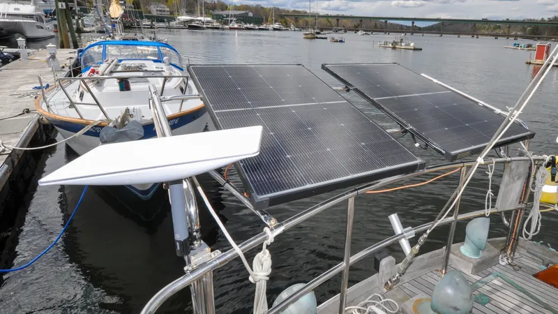 Slide: The Image of 1987 Wittholtz/Luzier 49 | Destiny Sailboat with solar panels docked at marina, Custom Wittholtz/Luzier Sloop/Cutter, 1987 model. - 6318988