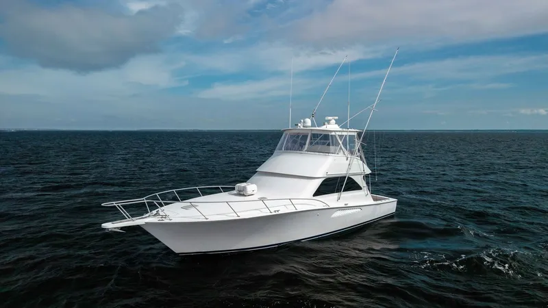 Slide: The Image of Starboard Bow View in Open Sea Captured cruising through open waters, the 2007 Viking 45 Convertible showcases its sleek design and sturdy build. The expansive bow deck is complemented by a robust railing, providing both safety and style. The flybridge offers excellent visibility for n - 6394758