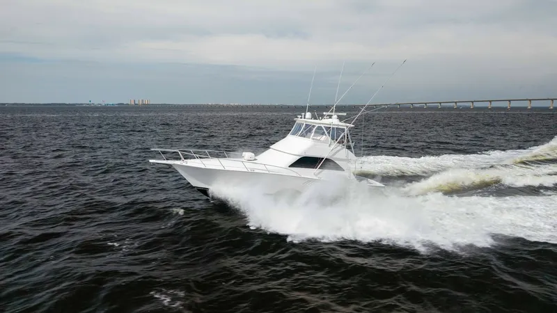 Slide: The Image of Dynamic Aerial View of Viking 45 The 2007 Viking 45 Convertible, 'Desperado', cuts through the water with precision, showcasing its sleek design and powerful performance. The vessel features a robust hull and spacious flybridge, perfect for sportfishing and cruising alike. Its elegant li - 6394763