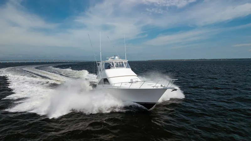 Slide: The Image of Dynamic Bow View in Motion Experience the power and elegance of the 2007 Viking 45 Convertible as it slices through the open waters. The sleek bow design is highlighted by the vessel's robust performance, showcasing its capability to handle various sea conditions. This image captur - 6394765
