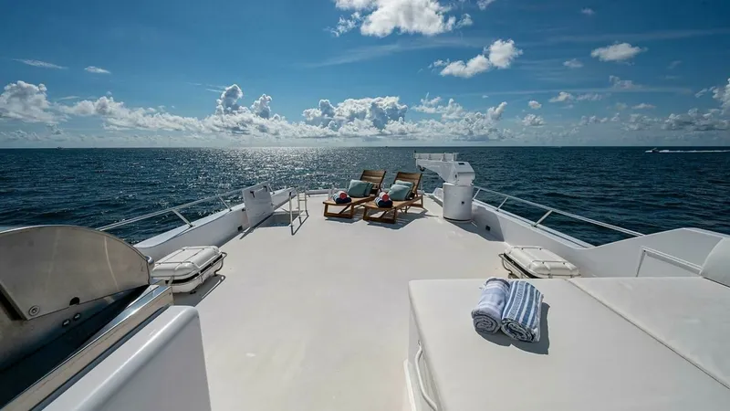 Slide: The Image of Spacious Sun Deck with Loungers This expansive sun deck on the 2003 Hatteras Raised Pilothouse offers a luxurious space for relaxation and sunbathing. Featuring comfortable lounge chairs and ample open space, it provides breathtaking ocean views for an unparalleled experience. The sleek - 6388428