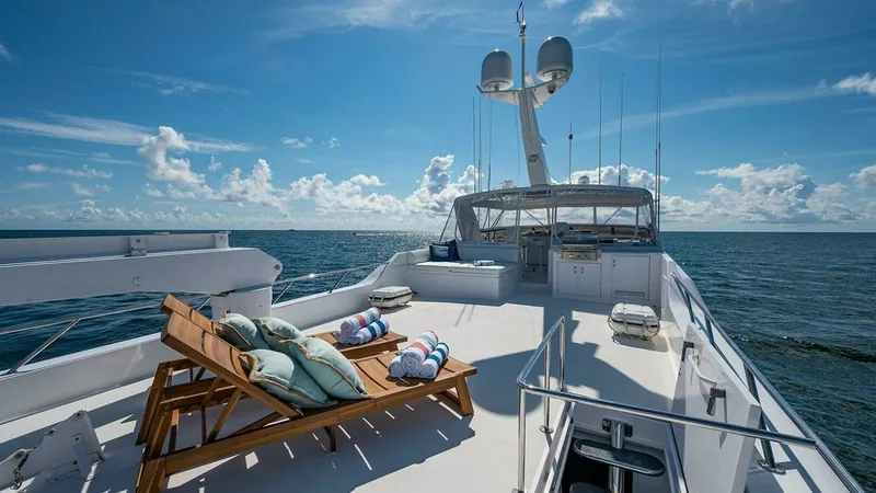 Slide: The Image of Spacious Sun Deck with Loungers The sun deck of the 2003 Hatteras Raised Pilothouse offers a luxurious outdoor retreat with comfortable loungers perfect for soaking in the sun. Surrounded by breathtaking ocean views, this area provides ample space for relaxation and socializing. The sle - 6388431