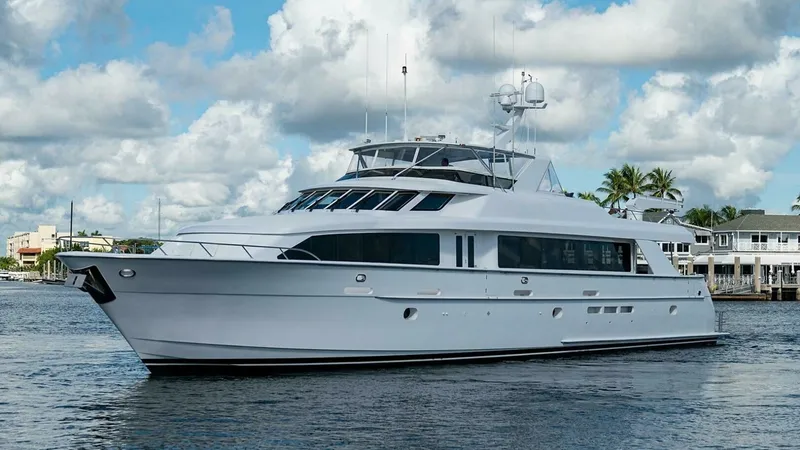 Slide: The Image of Starboard Side Exterior View This image showcases the starboard side of the 2003 Hatteras Raised Pilothouse, Magnum Ride. The sleek, classic lines highlight its robust construction and timeless design. Large windows provide ample natural light and panoramic views, enhancing the luxur - 6388459