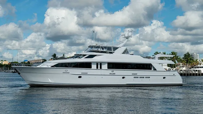Slide: The Image of Port Side Exterior View This image showcases the sleek profile of the 2003 Hatteras Raised Pilothouse, Magnum Ride. The yacht's elegant lines are complemented by expansive windows that promise abundant natural light inside. The spacious aft deck and modern superstructure highlig - 6388460