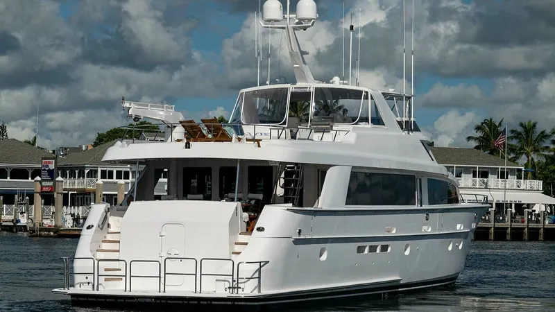 Slide: The Image of Aft View with Upper Deck Seating This image showcases the spacious aft of the 2003 Hatteras Raised Pilothouse, featuring elegant upper deck seating perfect for relaxation and entertainment. The vessel's sleek lines and substantial aft deck provide a luxurious outdoor space, complemented - 6388463