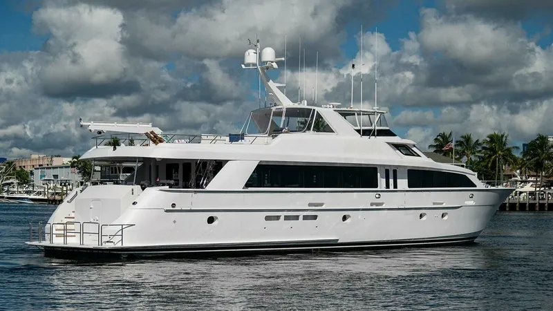 Slide: The Image of Port Side View of Raised Pilothouse This image showcases the sleek profile of the 2003 Hatteras Raised Pilothouse, emphasizing its elegant lines and spacious upper deck. The vessel's robust construction is complemented by large windows that promise ample natural light and panoramic views. T - 6388464