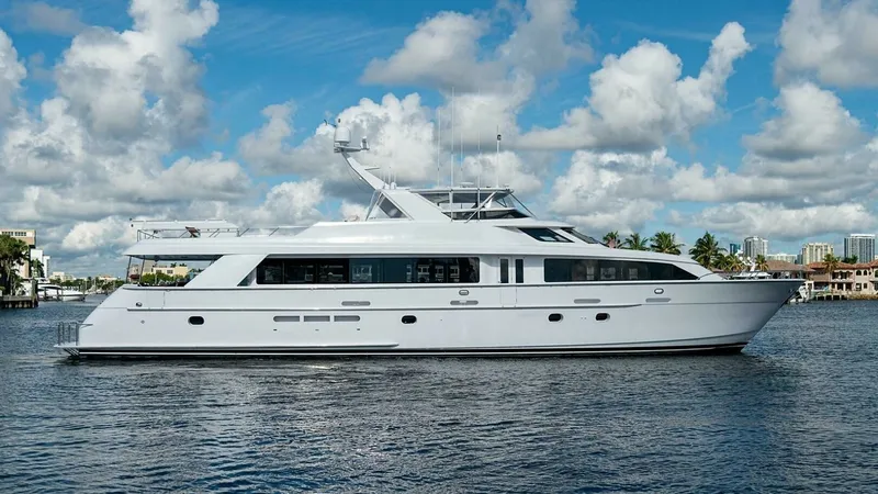 Slide: The Image of Starboard Profile View of Yacht This image showcases the starboard side of the 2003 Hatteras Raised Pilothouse yacht, Magnum Ride. The sleek, elongated profile emphasizes its elegant design and spacious layout. The yacht's clean lines and expansive windows promise luxurious interior spa - 6388465