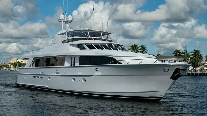 Slide: The Image of Starboard View of Raised Pilothouse This starboard view highlights the sleek lines and robust design of the 2003 Hatteras Magnum Ride. The vessel features a raised pilothouse with expansive windows for optimal visibility. Its classic white hull and modern aesthetic make it a standout on the - 6388467