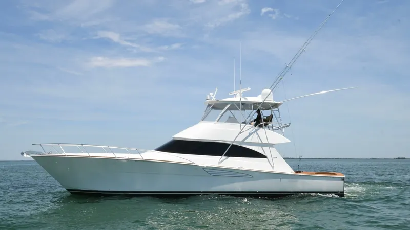 The Image of Starboard View of Viking 58 Convertible This image showcases the sleek starboard profile of the 2020 Viking 58 Convertible. The yacht features a robust, aerodynamic design with a spacious flybridge equipped with advanced fishing gear. The elegant hull lines and expansive deck space highlight Vi - 6388285
