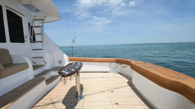 Slide: The Image of Spacious Aft Deck with Teak Flooring The aft deck of the 2020 Viking 58 Convertible features elegant teak flooring and ample seating, perfect for relaxation or entertaining. The clean lines and polished finishes create a sophisticated atmosphere, while the open layout offers unobstructed vie - 6388316