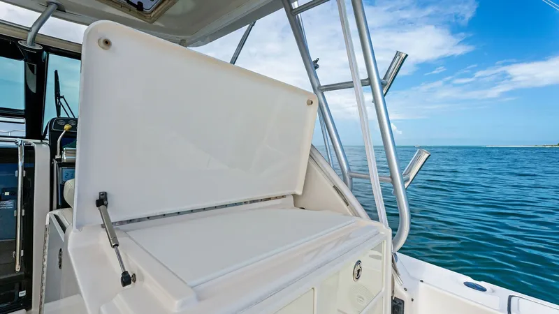 Slide: The Image of Cockpit Bait Prep Station The 2007 Tiara Yachts 32 Open features a well-equipped cockpit bait prep station, perfect for fishing enthusiasts. The station includes ample storage compartments and a sturdy work surface, designed for easy access and efficiency. Surrounded by a robust s - 6394583