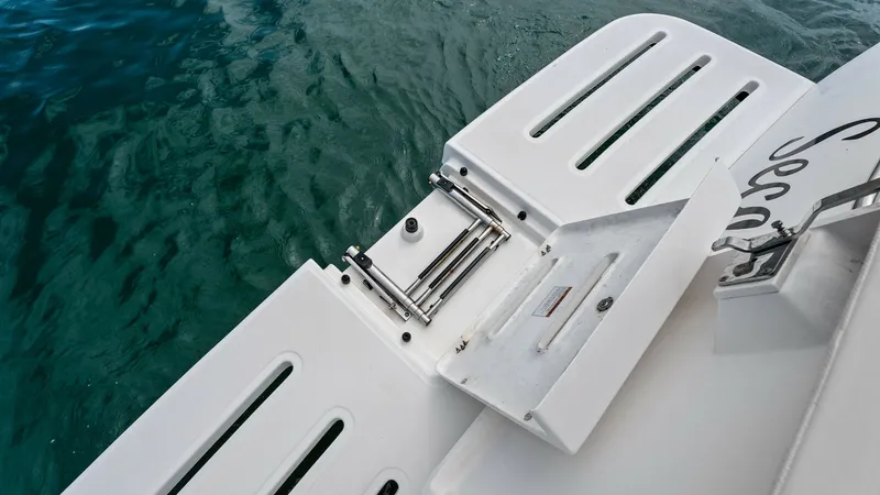 Slide: The Image of Swim Platform with Ladder This image showcases the swim platform of the 2007 Tiara Yachts 32 Open, featuring a sleek, integrated ladder for easy water access. The platform's clean, non-slip surface ensures safety and comfort. Perfect for leisure activities, it enhances the vessel' - 6394586