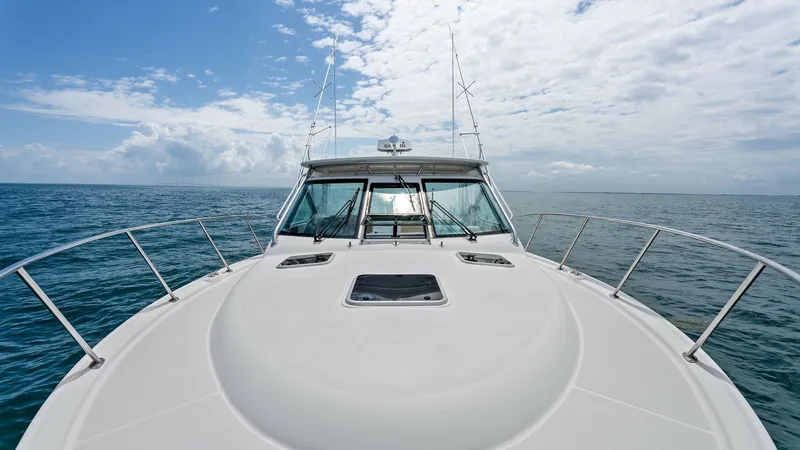 Slide: The Image of Expansive Foredeck with Hatch The Tiara Yachts 32 Open showcases a spacious foredeck with a sleek design and durable stainless steel railings, offering safety and elegance. A centrally located hatch provides convenient access below deck, enhancing functionality. The panoramic sea view - 6394572