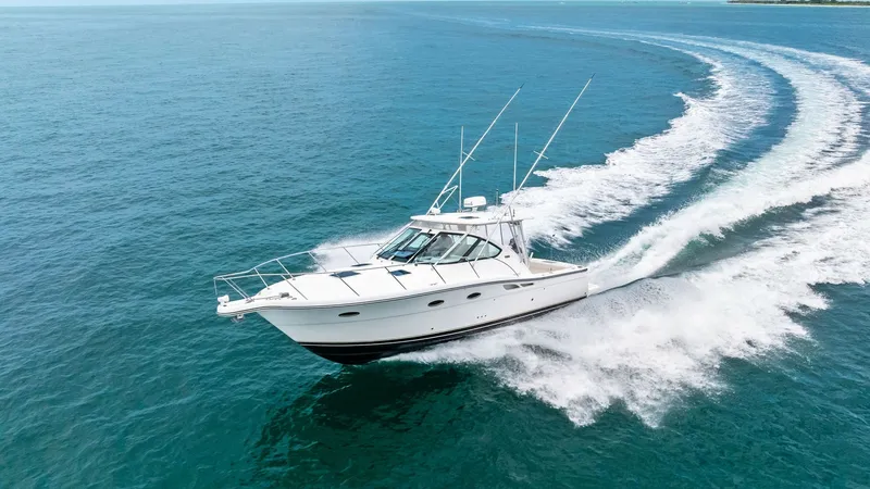 Slide: The Image of Dynamic Aerial View of 32 Open This striking aerial shot captures the Tiara Yachts 32 Open gliding effortlessly across the water. The vessel's sleek lines and robust build are highlighted as it carves a path through the sea, showcasing its powerful performance and agility. The spacious - 6394616
