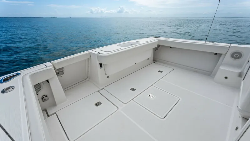 Slide: The Image of Spacious Aft Deck with Storage The aft deck of the 2007 Tiara Yachts 32 Open offers ample space for relaxation and entertainment. Featuring built-in storage compartments and a clean, non-slip surface, this area is perfect for fishing or enjoying the open sea. The sturdy construction an - 6394573