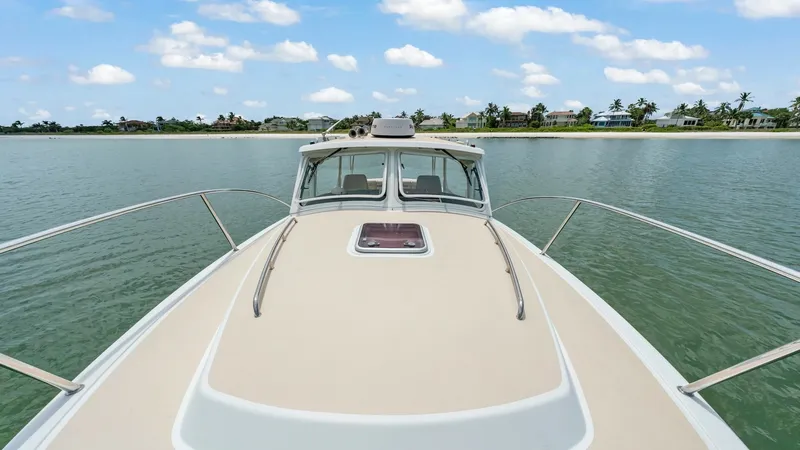 Slide: The Image of Forward Deck with Panoramic View The forward deck of the Camelot offers a spacious and sleek design, providing an unobstructed panoramic view of the water. The clean lines and durable finish ensure a stylish yet functional space, ideal for relaxation or navigating scenic routes. With stu - 6479383