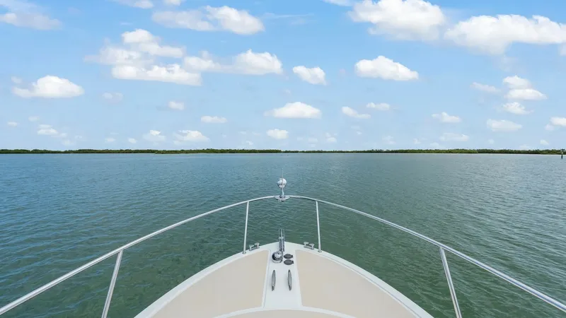 Slide: The Image of Bow View with Expansive Horizon The bow of the MJM 29z 'Camelot' gracefully cuts through calm waters, offering a serene view of the expansive horizon. The clean lines and sturdy railings highlight the vessel's sleek design, while the open sky and distant shoreline invite exploration. Th - 6479380