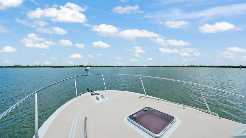 Slide: The Image of Foredeck with Hatch View The foredeck of the 2008 MJM 29z Camelot offers a spacious area with a clear view of the open water. Featuring a robust stainless steel railing and a central hatch, this deck is designed for both functionality and style. The clean lines and durable finish - 6479381
