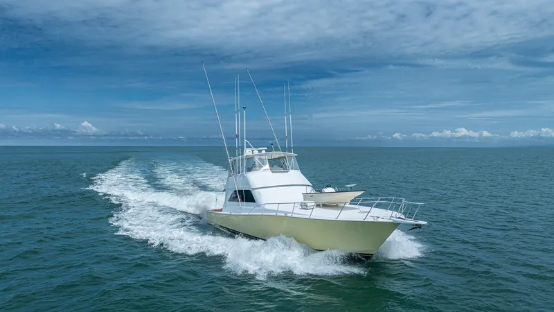 Slide: The Image of Dynamic Bow View at Sea 2002 Viking 61 Convertible The 2002 Viking 61 Convertible 'Bolita Too' cuts through the waves with precision, showcasing its sleek bow design. The vessel's powerful presence is highlighted by its robust construction and elegant lines, ideal for both sportfishing and leisure cruisin - 6683692
