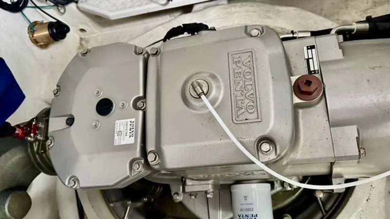 Slide: The Image of Engine Compartment with Volvo Penta Drive This image showcases the robust Volvo Penta drive system within the engine compartment of the 2023 Cruisers Yachts 50 Cantius. The well-organized layout features high-quality components, ensuring optimal performance and reliability. The clean installation - 6489161
