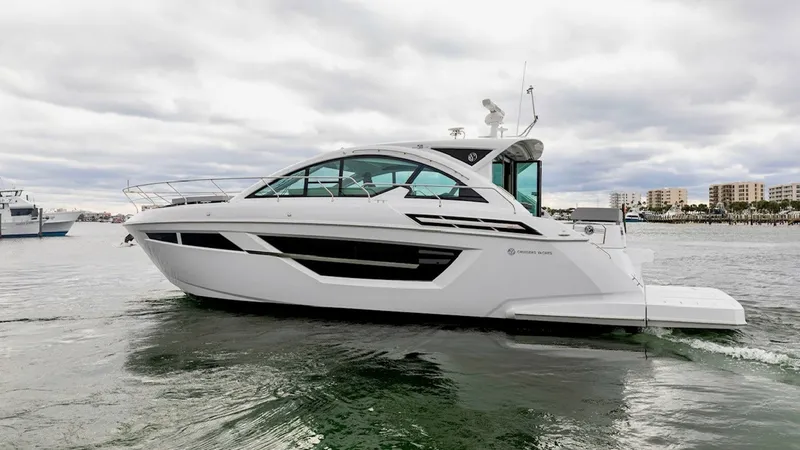 Slide: The Image of Side Profile of 2023 50 Cantius This image showcases the sleek side profile of the 2023 Cruisers Yachts 50 Cantius, highlighting its modern, aerodynamic design. The expansive windows and clean lines emphasize the yacht's luxurious and contemporary style. The hull's detailing and integra - 6489168