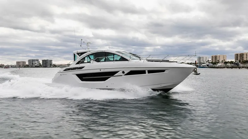 The Image of Cruisers Yachts 50 Cantius Side View The Cruisers Yachts 50 Cantius glides effortlessly across the water, showcasing its sleek and modern hull design. The side profile highlights expansive windows that promise panoramic views and abundant natural light in the interior. This model combines lu - 6489132