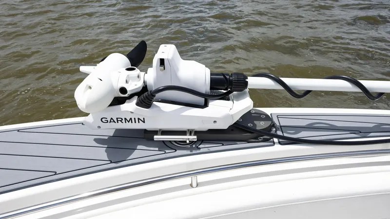 Slide: The Image of Bow with Mounted Trolling Motor This image showcases the bow of the 2005 Triton 351 Center Console, featuring a Garmin trolling motor securely mounted on the deck. The sleek design of the bow is complemented by a durable, non-slip surface, ensuring safety and stability. This setup is id - 6687478