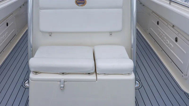 Slide: The Image of Center Console Seating Area This image showcases the comfortable seating area of the 2005 Triton 351 Center Console. The well-cushioned seats provide ample support, ideal for long days on the water. The clean design and durable materials ensure both style and functionality, perfect - 6687472