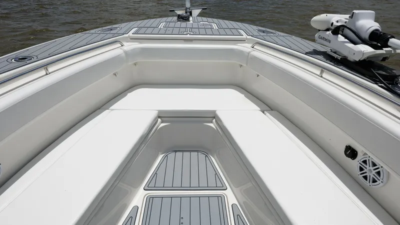 Slide: The Image of Spacious Bow Seating Area The 2005 Triton 351 Center Console features a spacious bow seating area, perfect for relaxation and socializing. The ergonomic design provides comfortable seating with ample legroom, while the non-slip decking ensures safety. A mounted trolling motor offe - 6687470
