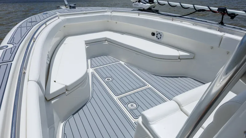 Slide: The Image of Spacious Bow Seating Area The bow of the 2005 Triton 351 Center Console features ample seating with plush cushions, ideal for relaxation and socializing. The deck is fitted with sleek, non-slip flooring, ensuring safety and comfort on board. Notable for its spacious layout, this a - 6687469