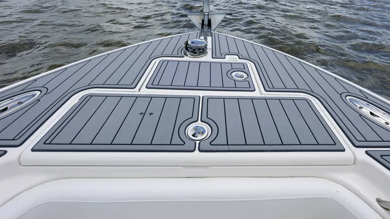 Slide: The Image of Bow Deck with Non-Skid Surface The bow deck of the 2005 Triton 351 Center Console features a sleek, non-skid surface for enhanced safety and comfort. The spacious area is ideal for casting or relaxing, while the integrated storage compartments provide ample space for gear. The clean li - 6687476