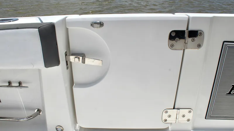Slide: The Image of Transom Door with Secure Latch This image showcases the transom door of the 2020 Blackfin 332 Center Console, featuring a sturdy and secure latch system. The sleek design ensures easy access to the swim platform, enhancing both functionality and safety. Durable hardware and a smooth fi - 6687440