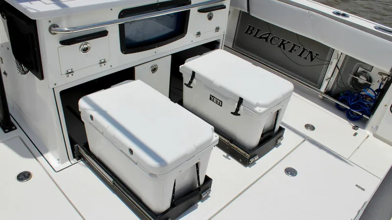 Slide: The Image of Aft Deck with Storage Coolers This aft deck of the 2020 Blackfin 332 Center Console features dual YETI coolers, perfect for keeping your catch fresh or storing refreshments. The white non-slip deck ensures safety and ease of movement, while the integrated storage compartments offer co - 6687449